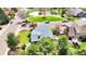 Charming home with a gray roof, complemented by mature trees and a well-kept lawn near a neighborhood park at 8133 W Quarto Ave, Littleton, CO 80128