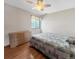 Bedroom featuring hardwood floors, natural light, and a wooden dresser at 8133 W Quarto Ave, Littleton, CO 80128