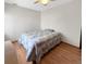 Bedroom with hardwood floors and a ceiling fan and light fixture at 8133 W Quarto Ave, Littleton, CO 80128
