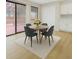 Bright dining area features a round table, comfortable seating, and sliding doors to an outdoor patio at 8133 W Quarto Ave, Littleton, CO 80128