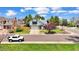 Traditional two-story home with an attached garage, landscaped yard, and a welcoming curb appeal at 8133 W Quarto Ave, Littleton, CO 80128
