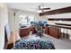 Efficient home office setup with multiple monitors and wood cabinets at 8133 W Quarto Ave, Littleton, CO 80128