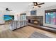 Spacious living room with a fireplace and laminate floors at 8133 W Quarto Ave, Littleton, CO 80128