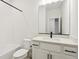 Bathroom featuring a white vanity, modern fixtures, and tiled shower-tub combination at 42966 Colonial Trl, Elizabeth, CO 80107