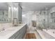 Bathroom featuring a stylish marble countertop with shower, and a modern vanity with cabinets at 5955 Blue Sage Way, Littleton, CO 80123