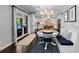Cozy dining area with a built-in bench, round table and access to the patio at 5955 Blue Sage Way, Littleton, CO 80123
