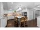 Spacious kitchen with a center island, stainless steel appliances, and eat in table at 5955 Blue Sage Way, Littleton, CO 80123