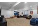 Spacious living room with plush carpeting, recessed lighting, and an entertainment area for the Gathering at 5955 Blue Sage Way, Littleton, CO 80123