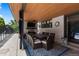 Relaxing patio with a fireplace and entertainment, with comfortable seating and stylish decor at 5955 Blue Sage Way, Littleton, CO 80123