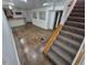 Basement features a finished bar, open space, and carpeted stairs at 3136 S Cathay Cir, Aurora, CO 80013