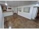 Spacious basement featuring a bar area, open shelving, and polished concrete floors at 3136 S Cathay Cir, Aurora, CO 80013