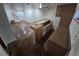 A large finished basement with a bar, cabinets, and access to another room with stairs at 3136 S Cathay Cir, Aurora, CO 80013
