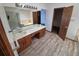 Spacious bathroom with tile flooring, dual sink vanity, walk-in shower, and separate tub at 3136 S Cathay Cir, Aurora, CO 80013