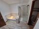 Bathroom featuring tile flooring, walk-in shower, separate tub, and a toilet at 3136 S Cathay Cir, Aurora, CO 80013