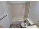Standard bathroom with shower and standard height commode at 3136 S Cathay Cir, Aurora, CO 80013