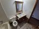 Cozy bathroom featuring tile flooring, single vanity, and a toilet with a bathtub at 3136 S Cathay Cir, Aurora, CO 80013