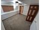 Bedroom featuring carpeted floors, paneled walls, and blinds for a cozy retreat at 3136 S Cathay Cir, Aurora, CO 80013