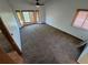 Bedroom showing a ceiling fan, neutral carpet and multiple windows to let in natural light at 3136 S Cathay Cir, Aurora, CO 80013