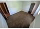 Neutral carpeted bedroom showcasing neutral walls and entry to other rooms at 3136 S Cathay Cir, Aurora, CO 80013