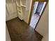 Walk-in closet with shelving and neutral carpet providing ample storage solutions at 3136 S Cathay Cir, Aurora, CO 80013