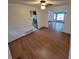 Open dining area featuring hardwood floors, a ceiling fan, and easy access to other rooms at 3136 S Cathay Cir, Aurora, CO 80013