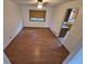 Dining area with hardwood floors, ceiling fan and a window offering natural light at 3136 S Cathay Cir, Aurora, CO 80013