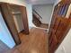 Inviting foyer with hardwood floors and a staircase leading to the upper level at 3136 S Cathay Cir, Aurora, CO 80013