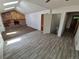 Spacious living room featuring vaulted ceilings, a wood-burning fireplace and an open layout to the entry at 3136 S Cathay Cir, Aurora, CO 80013