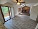 Living room features a cozy fireplace with wood accents and a sliding door leading to the outdoor deck at 3136 S Cathay Cir, Aurora, CO 80013