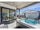Relaxing back patio with hot tub, grill and sliding glass doors into the dining area at 11492 Stonewash St, Littleton, CO 80125