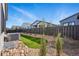 Landscaped backyard with putting green and covered patio showing the community at 11492 Stonewash St, Littleton, CO 80125