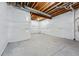 Unfinished basement with exposed ceiling, a concrete floor, and a clean, bright foundation at 11492 Stonewash St, Littleton, CO 80125