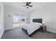 Bedroom featuring a large window, comfortable bed, and a ceiling fan at 11492 Stonewash St, Littleton, CO 80125