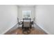 Bright dining area with modern chairs and a round table in a neutral color palette at 11492 Stonewash St, Littleton, CO 80125