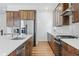 Modern kitchen with stainless steel appliances, quartz countertops and custom cabinetry at 11492 Stonewash St, Littleton, CO 80125