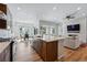 Well-designed kitchen island overlooks a dining area and a cozy living area at 11492 Stonewash St, Littleton, CO 80125