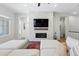 Bright living room showcasing a marble fireplace, hardwood floors, and a spacious gray sectional sofa at 11492 Stonewash St, Littleton, CO 80125