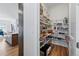 Spacious pantry with organized shelving to the kitchen and dining area at 11492 Stonewash St, Littleton, CO 80125