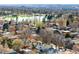 Scenic aerial view overlooking the community, with a glimpse of a serene lake surrounded by lush greenery at 418 S Gilpin St, Denver, CO 80209