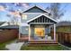 Exterior view of home highlighting the covered patio and outdoor seating area at 418 S Gilpin St, Denver, CO 80209