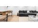 Basement featuring a foosball table and inviting dark gray sofa with accent pillows at 418 S Gilpin St, Denver, CO 80209