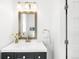 Elegant bathroom with vanity, decorative mirror, and stylish faucet at 418 S Gilpin St, Denver, CO 80209