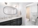 Modern bathroom featuring a dual vanity with views to the toilet and tub at 418 S Gilpin St, Denver, CO 80209