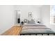 This bedroom features a hardwood flooring and access to the ensuite bathroom at 418 S Gilpin St, Denver, CO 80209