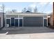 Two-car garage with blue siding and functional door, providing secure parking at 418 S Gilpin St, Denver, CO 80209
