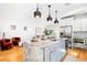 Modern kitchen with granite countertops, stainless steel appliances, and a large island at 418 S Gilpin St, Denver, CO 80209