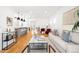 Spacious living area featuring modern decor, hardwood floors, and open layout at 418 S Gilpin St, Denver, CO 80209