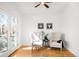 Bright living room featuring wood floors and french doors that lead to the exterior at 418 S Gilpin St, Denver, CO 80209