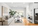 Bright and airy living room with modern decor, and glass sliding door to outdoor living at 418 S Gilpin St, Denver, CO 80209