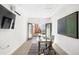 Bright office with modern decor, sleek desk, and backyard view at 418 S Gilpin St, Denver, CO 80209